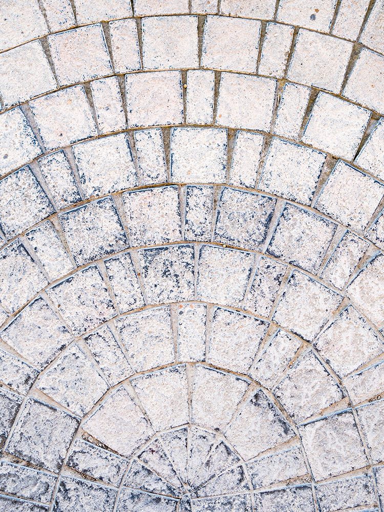 arched-cobblestone-pavement-road-with-edge-courses-sidewalk-texture