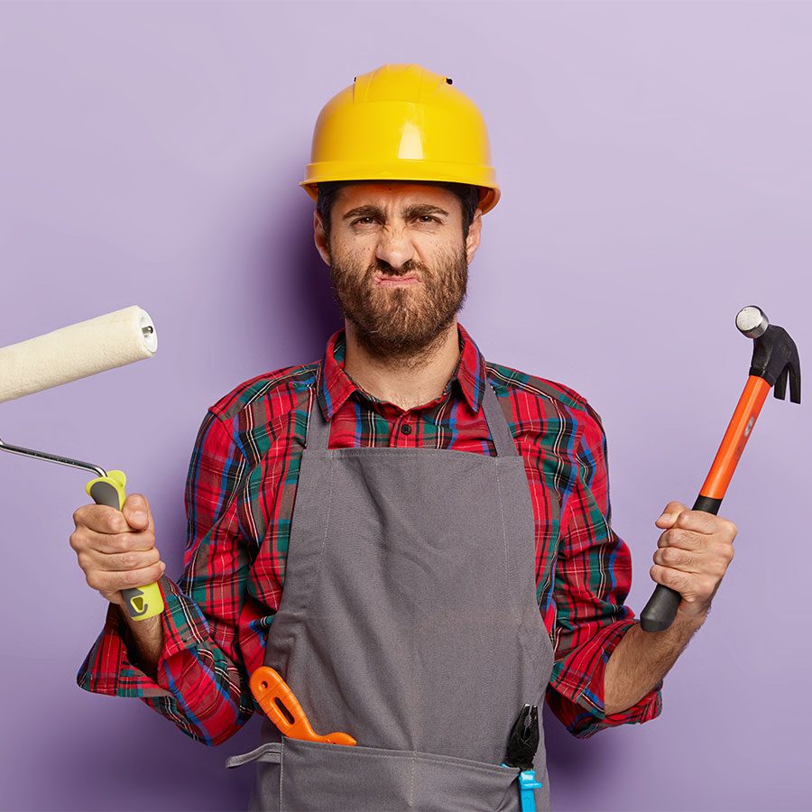 photo-displeased-male-builder-smirks-face-with-unhappy-expression